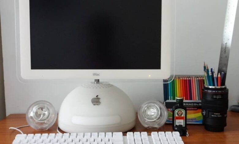 apple imac on desktop with some colors