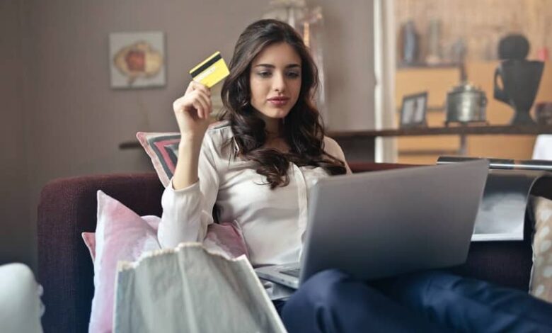 woman with credit card in hand
