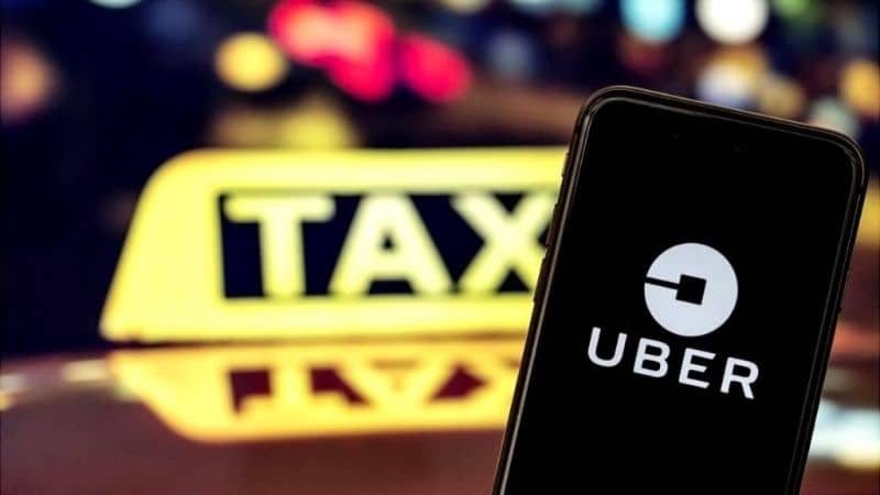 yellow uber taxi sign