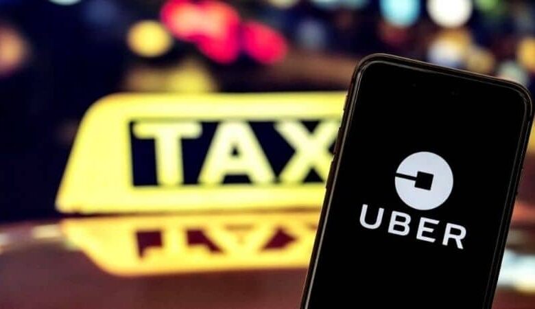 yellow uber taxi sign