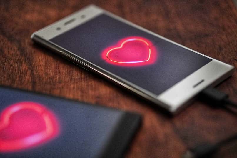 two phones with hearts