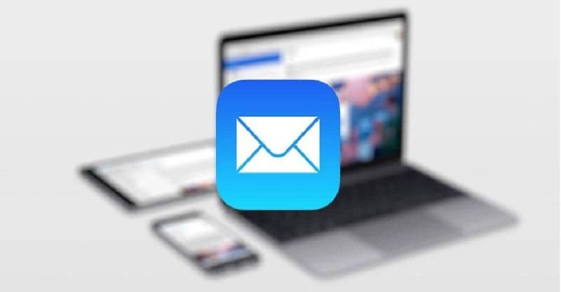Mail icon on MacOS with laptop on blurred background